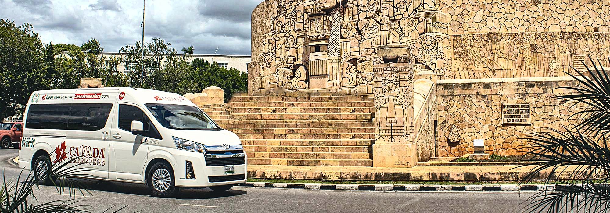 Canada Transfers van beside the Monumento a la Patria in Mérida, Mexico