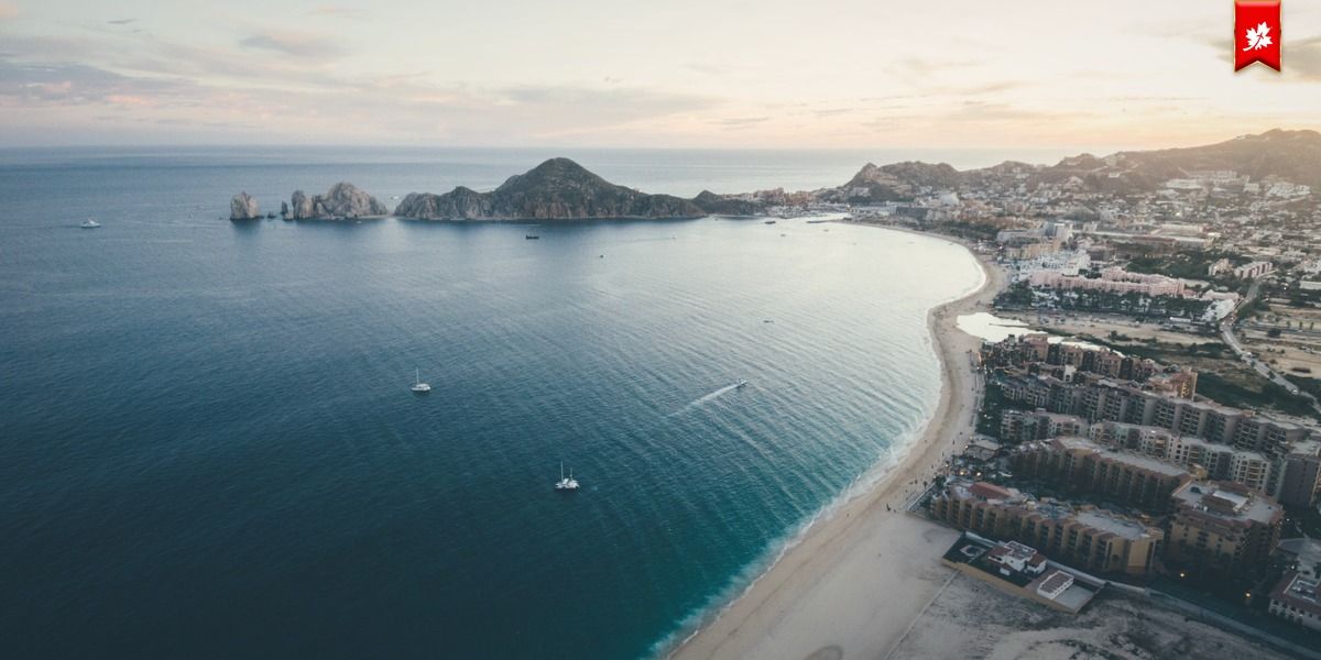 Aerial view of Medano Beach along Cabo San Lucas bay – airport transfer to Viceroy