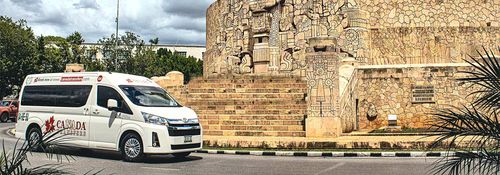 Canada Transfers van beside the Monumento a la Patria in Mérida, Mexico